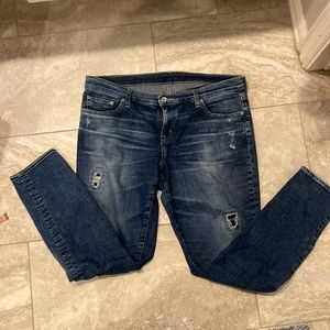 Big Star distressed patched jeans.